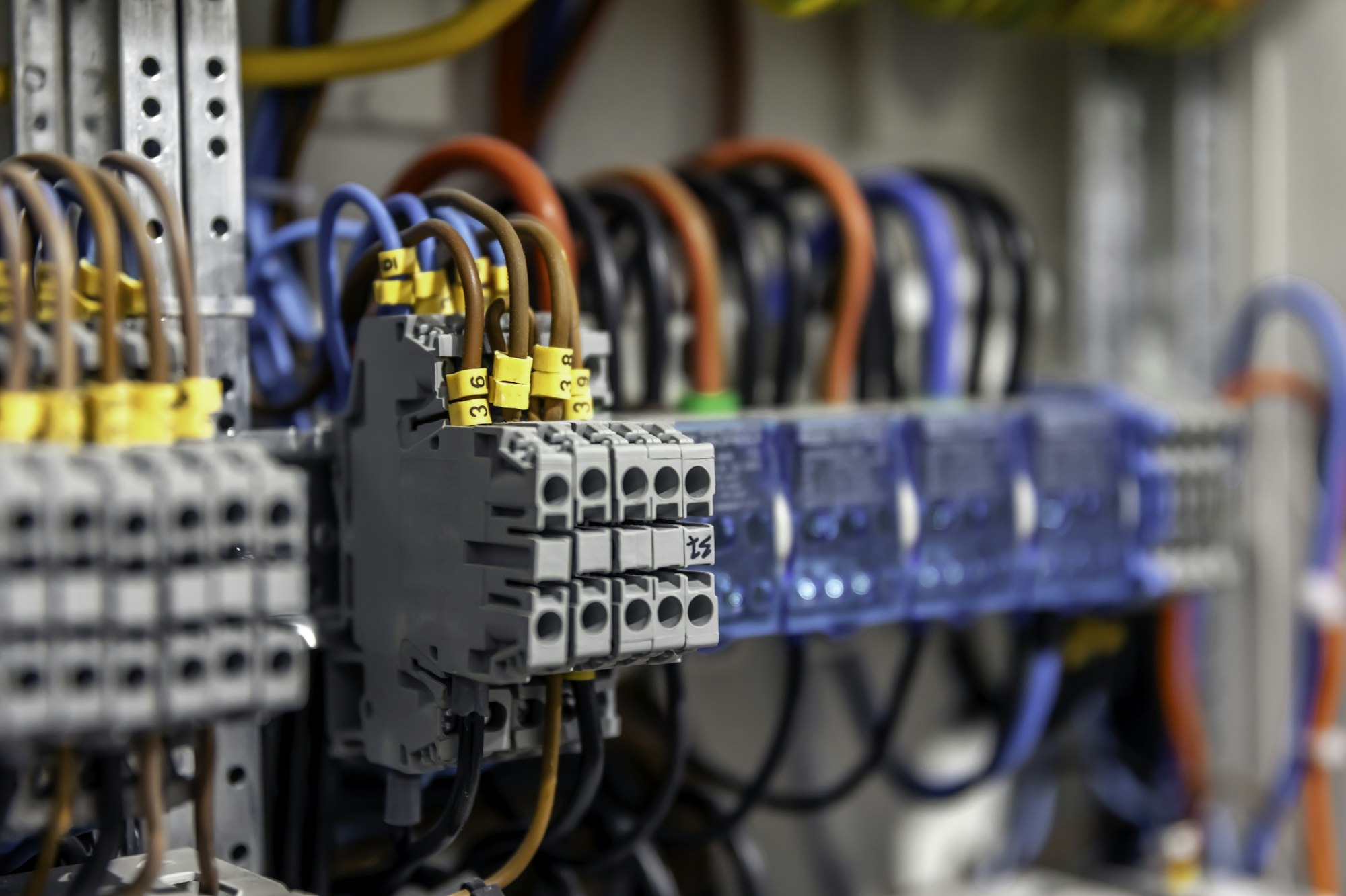 Electrical panel with fuses and contactors, close-up.